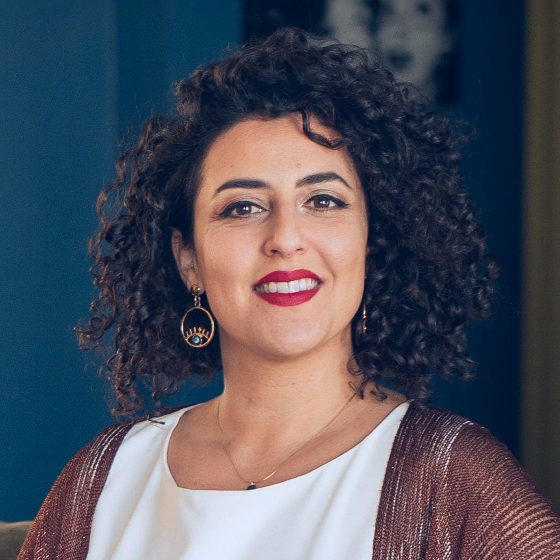 Asha Singh smiling, the author photo from her Healing Beyond Pills newsletter.