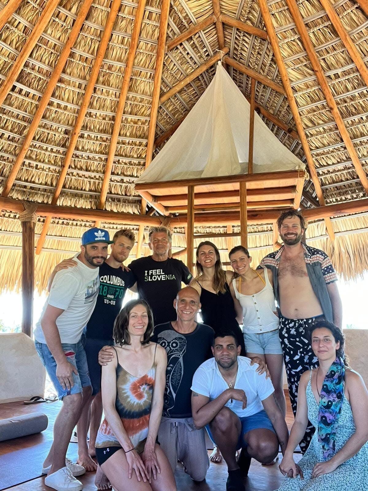 Retreat group under the palapa roof at an eco lodge in Mexico.